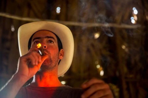 Tobacco farmer, tobacco farmer Luis Manne Alvares Rodrigues lights a Havana cigar, tobacco farm in