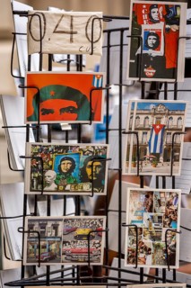 Kiosk saleswoman, Cuban, postcard stand with postcards of Ernesto Che Guevara, La Habana, Cuba,
