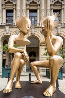 Golden art figures on the Plaza de San Francisco in the old town of Cuba, artist Etienne La