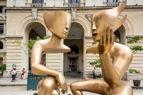 Golden art figures on the Plaza de San Francisco in the old town of Cuba, artist Etienne La