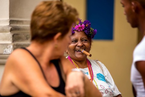 Old Cuban woman with cigar addresses tourists, La Habana, Havana, Cuba, Cuba, Europe, aerial view,