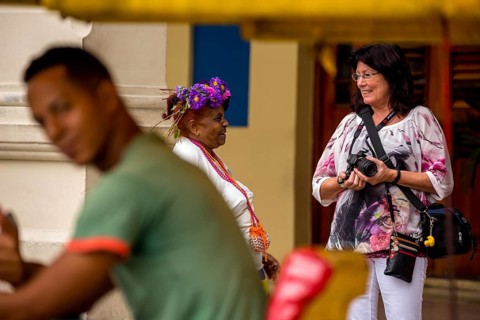 Old Cuban woman with cigar addresses tourists, La Habana, Havana, Cuba, Cuba, Europe, aerial view,