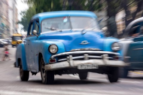 Blue vintage car in street scene, Old American street cruiser on the streets of Havana, Taxi, La