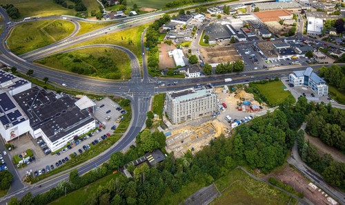 Aerial view, construction site with new hotel building on the corner of Flandersbacher Weg and