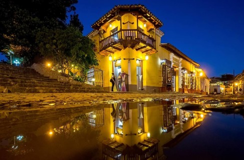 Restaurant and pub in the old town of Trinidad with visitors at the blue hour, Trinidad, Cuba,