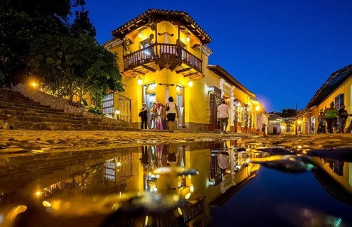 Restaurant and pub in the old town of Trinidad with visitors during the blue hour, Trinidad, Cuba,