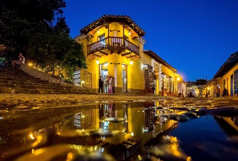 Restaurant and pub in the old town of Trinidad with visitors during the blue hour, Trinidad, Cuba,