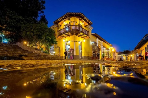 Restaurant and pub in the old town of Trinidad with visitors during the blue hour, Trinidad, Cuba,