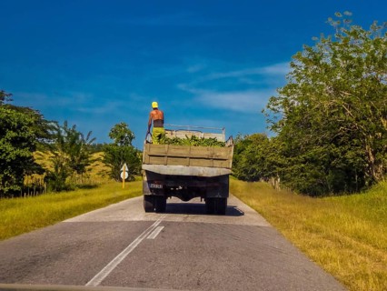Street scene on the country roads of Yaguanabo with banana lorries, Yaguanabo, Cuba, Cienfuegos,