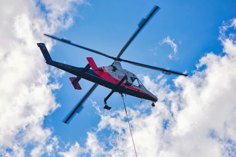Helicopter flying high in the sky on a clear day, transport helicopter, timber transport, Saas