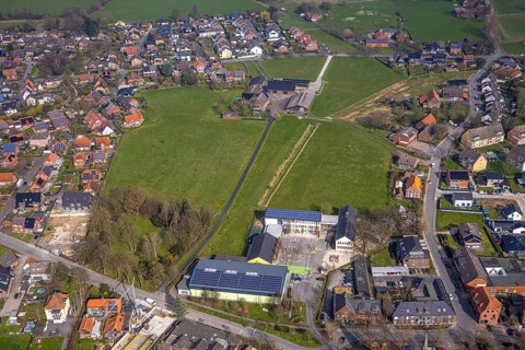 Aerial view, meadow area and planned building area between Hof Northoff and catholic Lambertischule