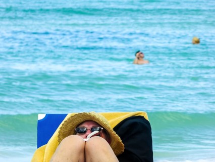 Sunbathing on loungers, reading on holiday, Varadero, Cuba, Matanzas, Cuba, Central America