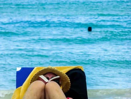 Sunbathing on loungers, reading on holiday, Varadero, Cuba, Matanzas, Cuba, Central America