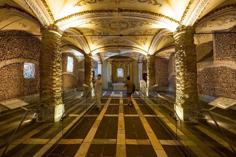 Piled bones in the ossuary, Capela dos ossos parede, chapel of bones, bone chapel, ossuary in