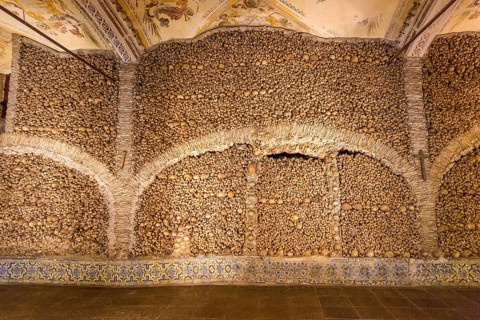 Piled bones in the ossuary, Capela dos ossos parede, chapel of bones, bone chapel, ossuary in