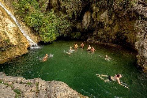 Small bathing lake in the Valle de los Ingenios with tourists, Trinidad, Cuba, Sancti Spíritus,