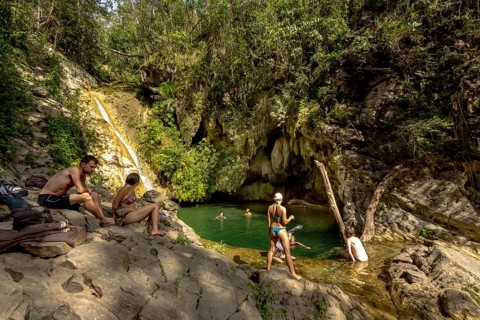 Small bathing lake in the Valle de los Ingenios with tourists, Trinidad, Cuba, Sancti Spíritus,