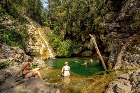 Small bathing lake in the Valle de los Ingenios with tourists, Trinidad, Cuba, Sancti Spíritus,