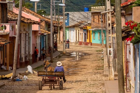 Cuban rider cowboy with his horse in the streets of Trinidad, Trinidad, Cuba, Sancti Spíritus,