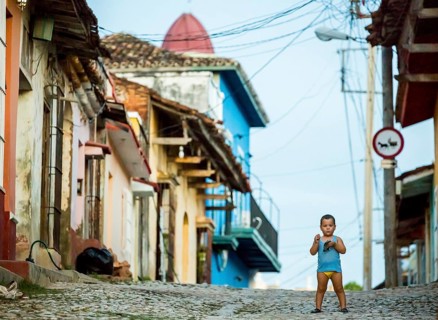 Little boy with nappies standing on the street, street scene in the old town of Trinidad, Trinidad,