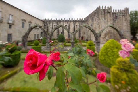 Jardim de Santa Barbara borders the crenellated facade of Antigo Paco Episcopal, former