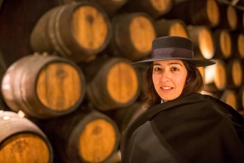 Classic travel guide with student robe, zorro hat and cape, port wine barrels, wine cellar of the