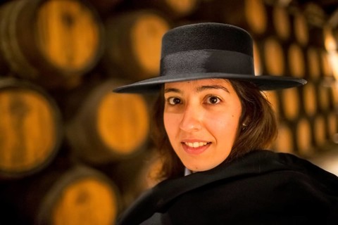 Classic travel guide with student robe, zorro hat and cape, port wine barrels, wine cellar of the