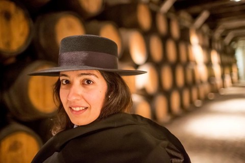 Classic travel guide with student robe, zorro hat and cape, port wine barrels, wine cellar of the