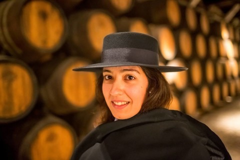 Classic travel guide with student robe, zorro hat and cape, port wine barrels, wine cellar of the