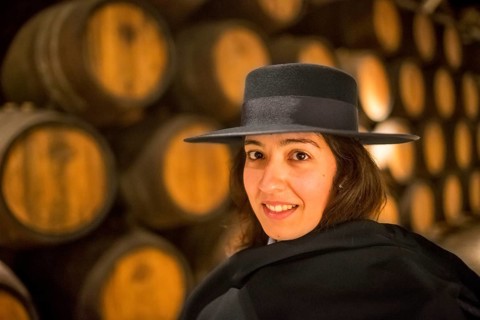 Classic travel guide with student robe, zorro hat and cape, port wine barrels, wine cellar of the