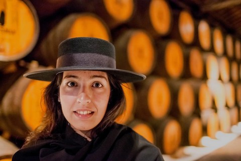 Classic travel guide with student robe, zorro hat and cape, port wine barrels, wine cellar of the