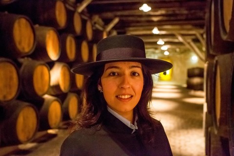 Classic travel guide with student robe, zorro hat and cape, port wine barrels, wine cellar of the