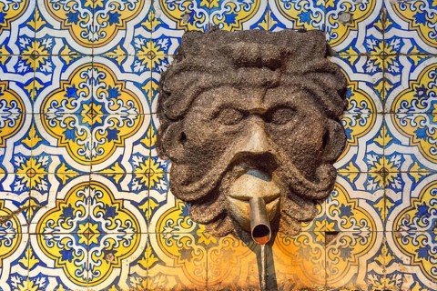 Fountain in the Sandemann cellar with historical tiles, gargoyles, azulejos, wine cellar of the