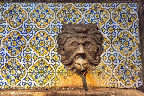 Fountain in the Sandemann cellar with historical tiles, gargoyles, azulejos, wine cellar of the
