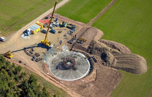 Aerial view, construction site with construction crane for wind turbine wind power plant at