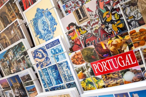 Postcards of Coimbra at a postcard stand, Miranda do Corvo, Coimbra district, Portugal, Europe,