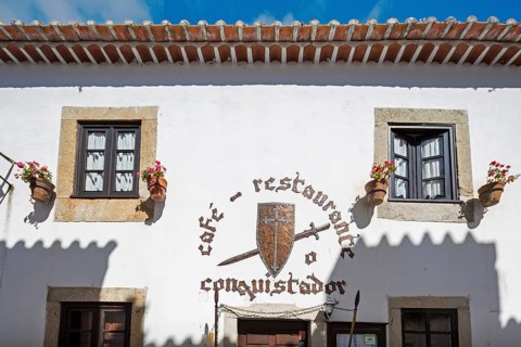 Picturesque facades with primroses and flower pots, picturesque small town Obidos, Ãbidos, district