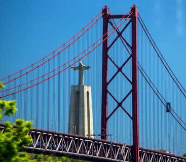 The 113 metre high Cristo-Rei statue of Christ, erected in 1959, photographed through the Puente 25