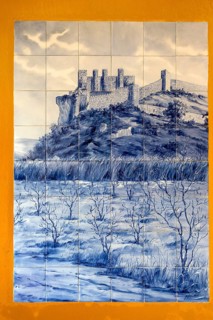 Azelejos, painted tiles with the city motif of the city wall and Obidos Castle, picturesque small