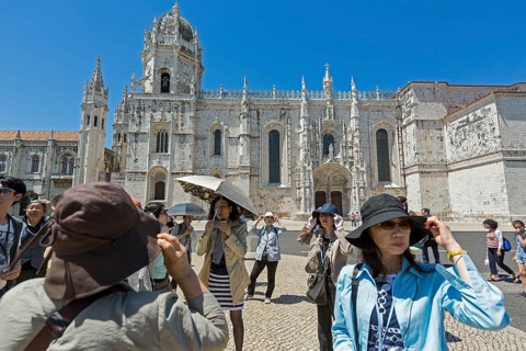 Japanese tourists in front of the Mosteiro dos Jerónimos, UNESCO World Heritage Site, Lisbon,