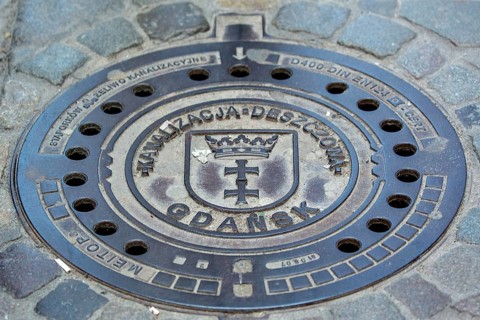 GdaÅsk, decorated manhole cover, city of Gdansk, Gdansk, Baltic Sea coast, Baltic Sea, pomorskie,