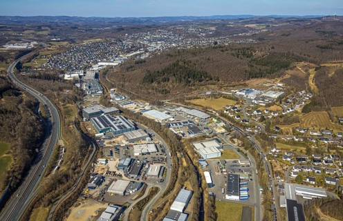 Aerial view, commercial area Im Langen Feld, left motorway A45, right forest area, view to Olpe,