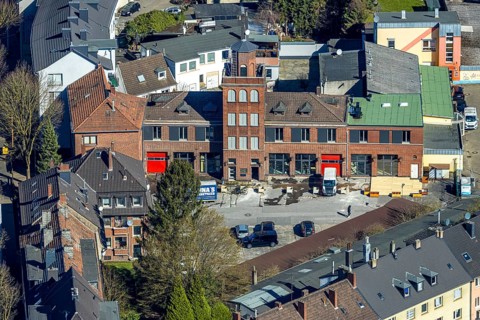 Aerial view, old fire station with tower on the main street, planned redesign for residential area,