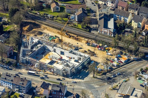 Aerial view, construction site with new building shopping centre Rewe supermarket,