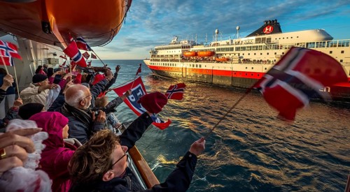 Tourists at the ship's railing, ship MS Finnmarken, Norwegian flags, Mehamn, Finnmark, Norway,