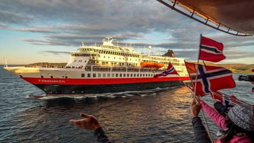 Tourists at the ship's railing, ship MS Finnmarken, Norwegian flags, Mehamn, Finnmark, Norway,