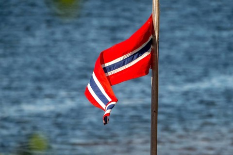 Norwegian flag on the river, Kirkenes, Finnmark, Norway, Scandinavia, Europe, adventure travel,