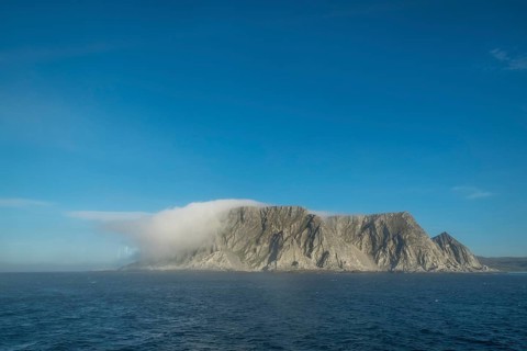 Island in the fog, Kjøllefjord, Finnmark, Norway, Scandinavia, Europe, adventure travel, tourism,