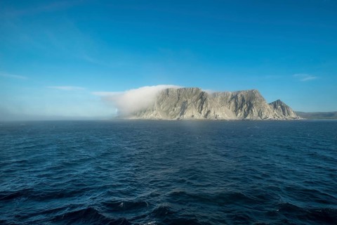 Island in the fog, Kjøllefjord, Finnmark, Norway, Scandinavia, Europe, adventure travel, tourism,