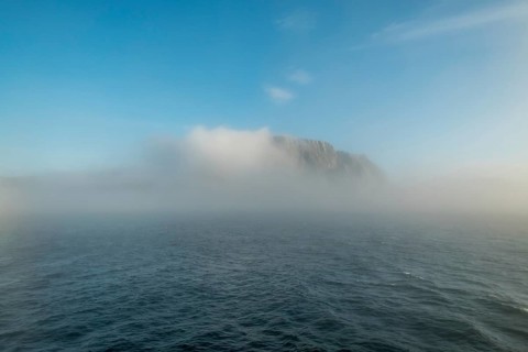 Island in the fog, Kjøllefjord, Finnmark, Norway, Scandinavia, Europe, adventure travel, tourism,